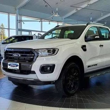 White Ford Ranger Wildtrak in a dealership showroom